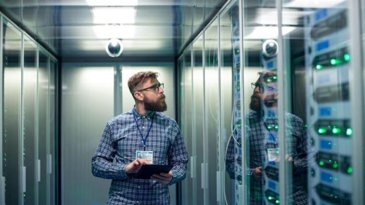 digital infrastructure, IT worker in a server room