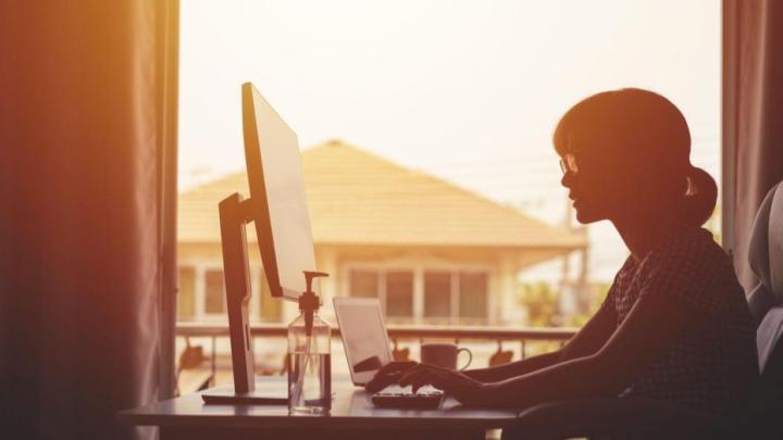 Digital Transformation Risk, woman working from home as part of digital transformation and cloud