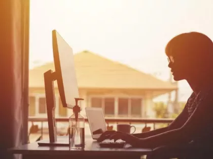 Digital Transformation Risk, woman working from home as part of digital transformation and cloud