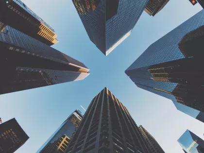 ground view of tall skyscrapers on a clear day